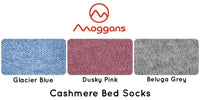 Three knitted fabric swatches in Glacier Blue, Dusky Pink, and Beluga Grey are shown beneath the Moggans logo, with “Cashmere Bed Socks – Made in Scotland” below—highlighting our luxury Scottish bed socks collection.