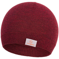 The Moggans 100% Merino Wool Beanie, made in Scotland, features a maroon knit with a ribbed edge and a white rectangular front label displaying an orange logo and Moggans. Crafted from mulesing-free Merino wool.