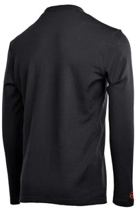 The Moggans 100% Merino Long Sleeve Baselayer – Midweight features a plain black, moisture-wicking design with no visible logos or patterns except a small red emblem on the left wrist, shown from the back.