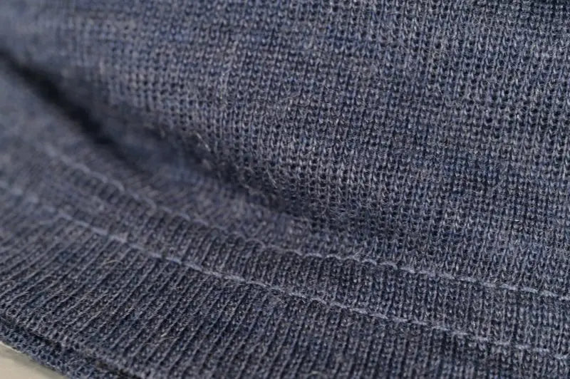 Close-up of the Moggans Merino Wool Neck Gaiter with TENCEL™ Lyocell in blue, highlighting detailed stitching, soft texture, and a horizontal seam near the bottom.