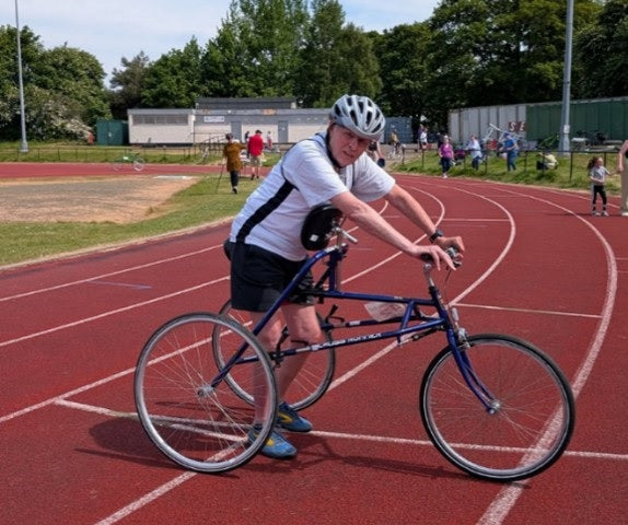 Bill, a frame runner, competing in a marathon wearing Moggans socks