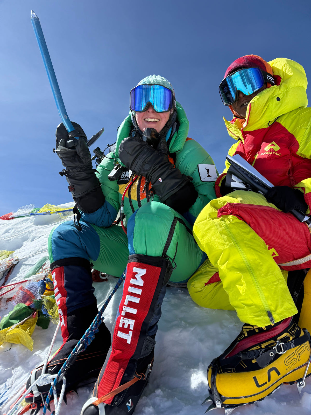 Julia Hamilton on the summit of Makalu, 8,485m, 20 May 2026, smiling with ice axe raised alongside Lakpa Sherpa