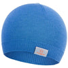 The 100% Merino Wool Beanie by Moggans is a plain blue knit hat made in Scotland from mulesing-free wool, featuring a ribbed edge and a small white tag with an orange logo and "Moggans" text on the front.