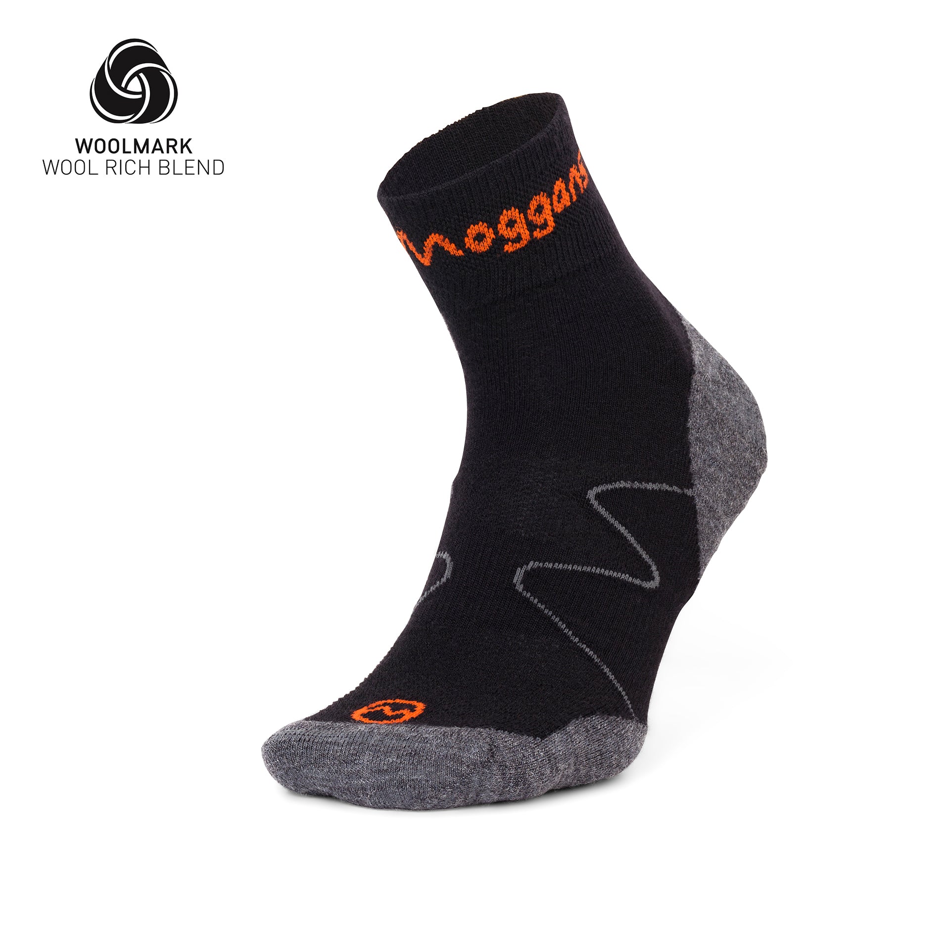 A black and grey Moggans Lightweight Merino Ankle Sock with orange accents stands upright to show the heel, toe, and side. The Woolmark logo and “WOOL RICH BLEND” text are displayed in the top left corner.