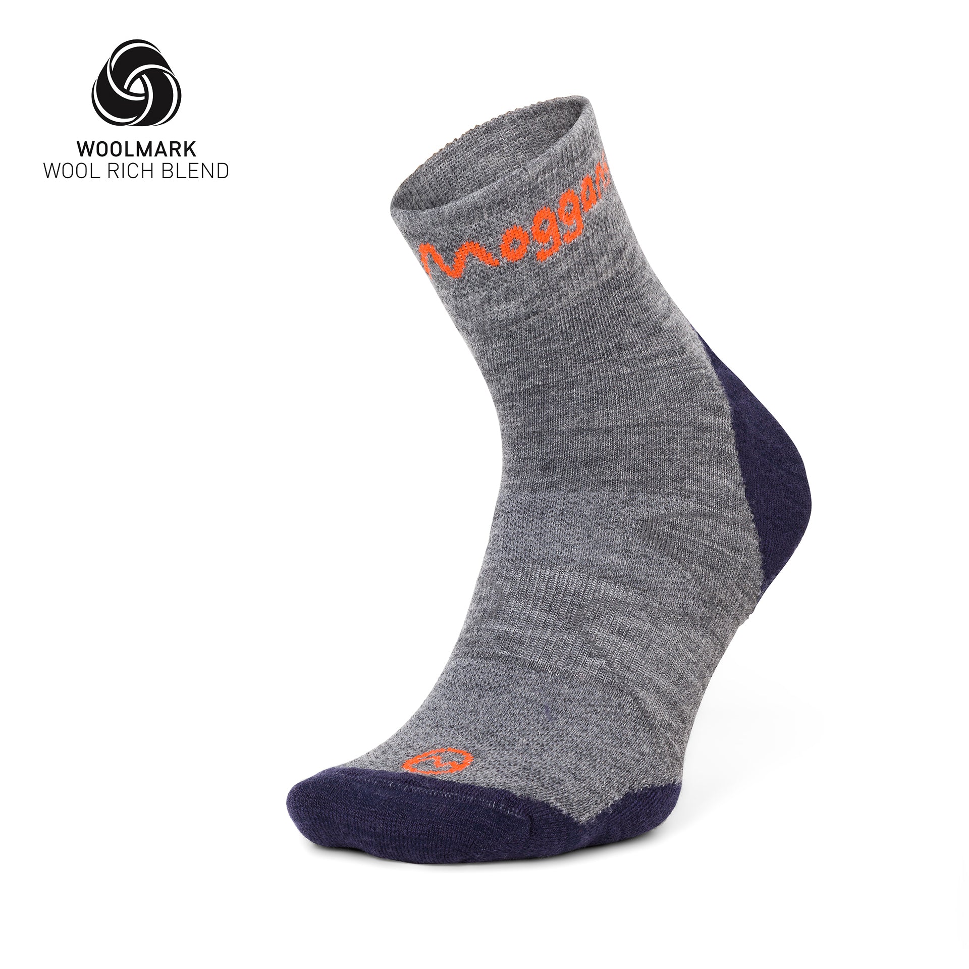 A single Lightweight Merino Ankle Sock by Moggans in gray and navy, with orange branding, is displayed upright. The Woolmark logo and Wool Rich Blend in the corner highlight its moisture-wicking running performance.