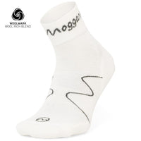 A single white Moggans Lightweight Merino Ankle Sock features black zigzag lines, the Moggans logo on the cuff, a small circular logo near the toe, moisture-wicking fabric, and Woolmark and Wool Rich Blend logos in the corner—ideal for running.