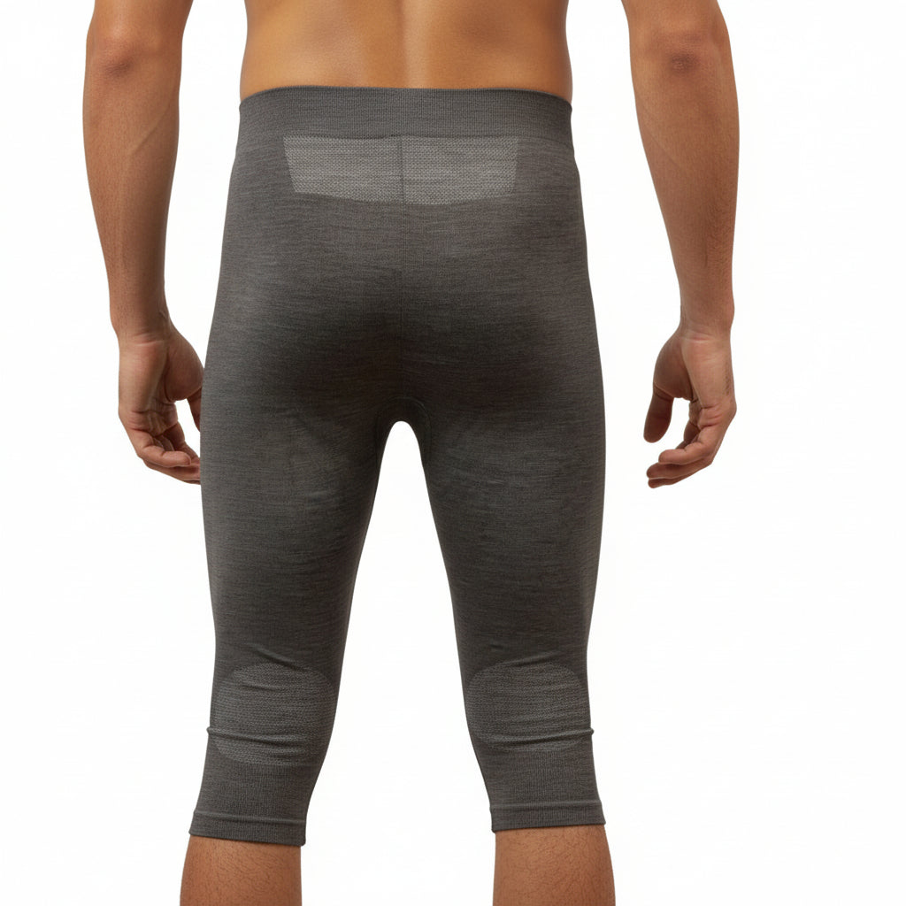 Men's Moggans Schiehallion 3/4 Merino Wool Leggings shown from the back. Seamless thermoregulating construction with moisture-wicking Merino wool for alpine performance.
