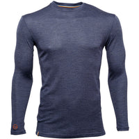 The Men's Moggans Merino Long Sleeve Baselayer with TENCEL™ is a slim fit, heathered navy crew neck shirt with a small orange logo by the left wrist, made from a sustainable and thermoregulating TENCEL™ Lyocell blend.