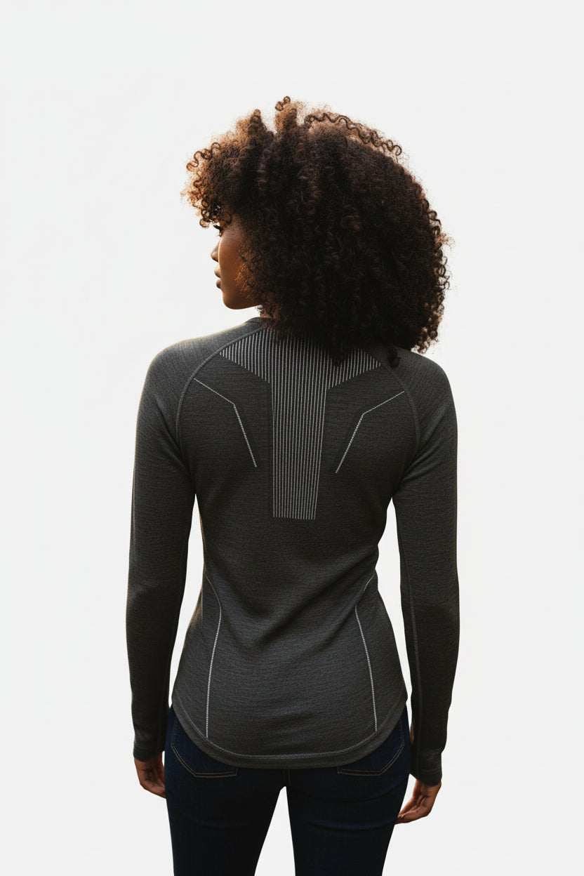 Women's Moggans Schiehallion Merino Wool Base Layer back view, showing seamless construction and long sleeve design. Odour-resistant Merino wool for multi-day alpine adventures.
