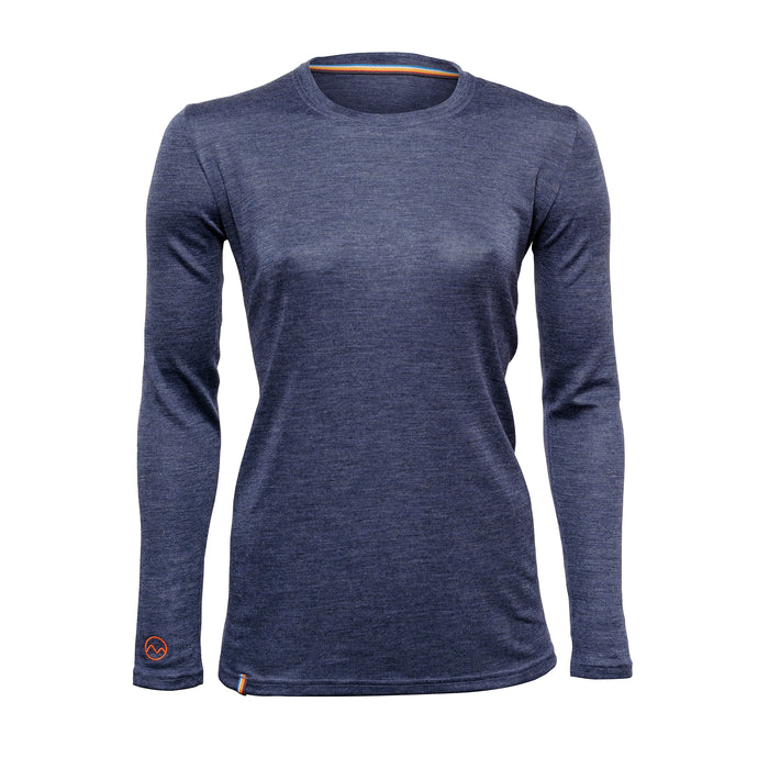 The Moggans Merino Long Sleeve Base Layer with TENCEL™ is a womens specific slim fit, heathered navy crew neck shirt with a small orange logo by the left wrist, made from a sustainable and thermoregulating TENCEL™ Lyocell blend.